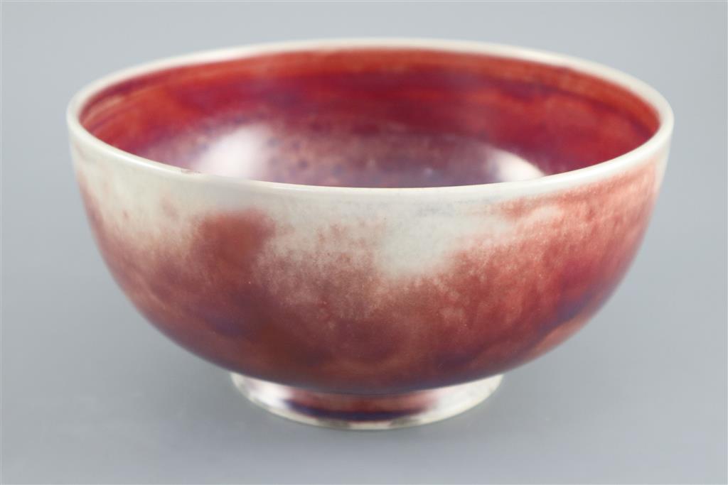 A Ruskin high fired flambe footed bowl, dated 1924, 22cm diameter